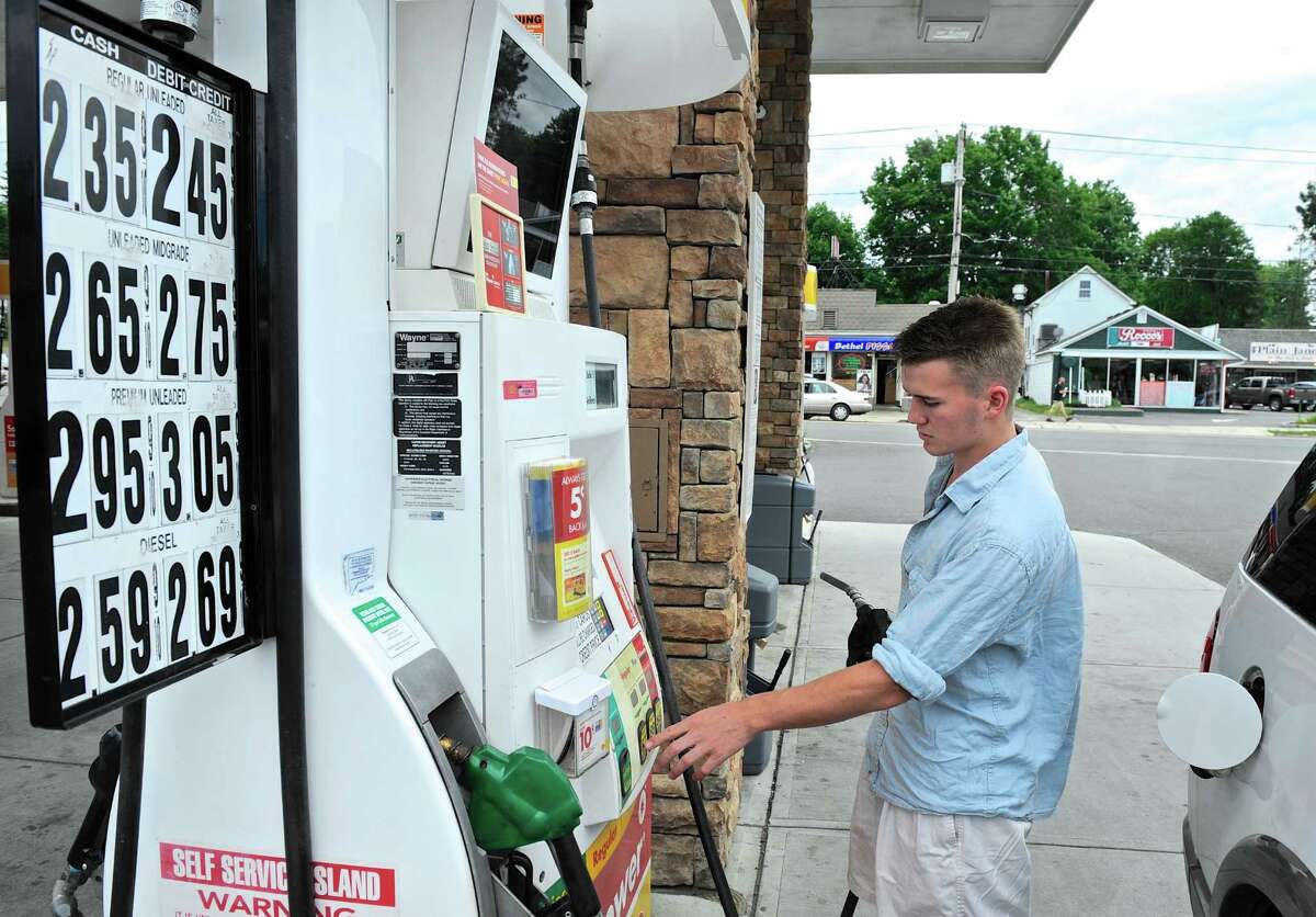 Quinn Whelehan, of Redding, fills up at the Greenwood Avenue Shell station in Bethel. Gas prices have fallen nationally over the past week. Tuesday, July 5, 2016, in Bethel, Conn.