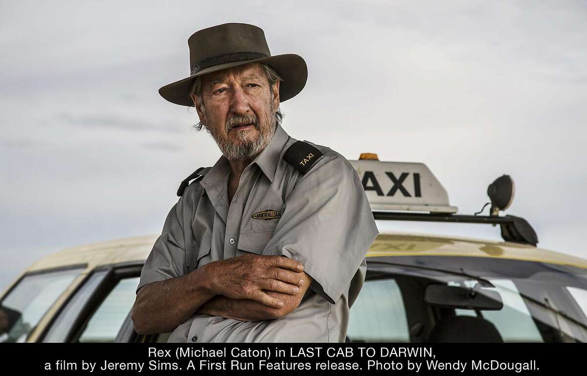 Terminally ill Rex (Michael Caton) decides to drive his taxi to Darwin to see a right-to-die doctor in the wry dramedy "Last Cab to Darwin." Credit: First Run Features
