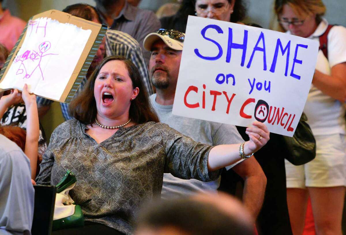 Black Rock resident Joanna Wesson protests with hundreds of other residents from that neighborhood over a raise in property taxes, during the Bridgeport City Council's meeting at Bridgeport City Hall in Bridgeport, Conn. on Tuesday July 5, 2016. High profile residents including former U.S. Comptroller General David Walker and former mayoral candidate Mary-Jane Foster were on hand to protest the hike as well.