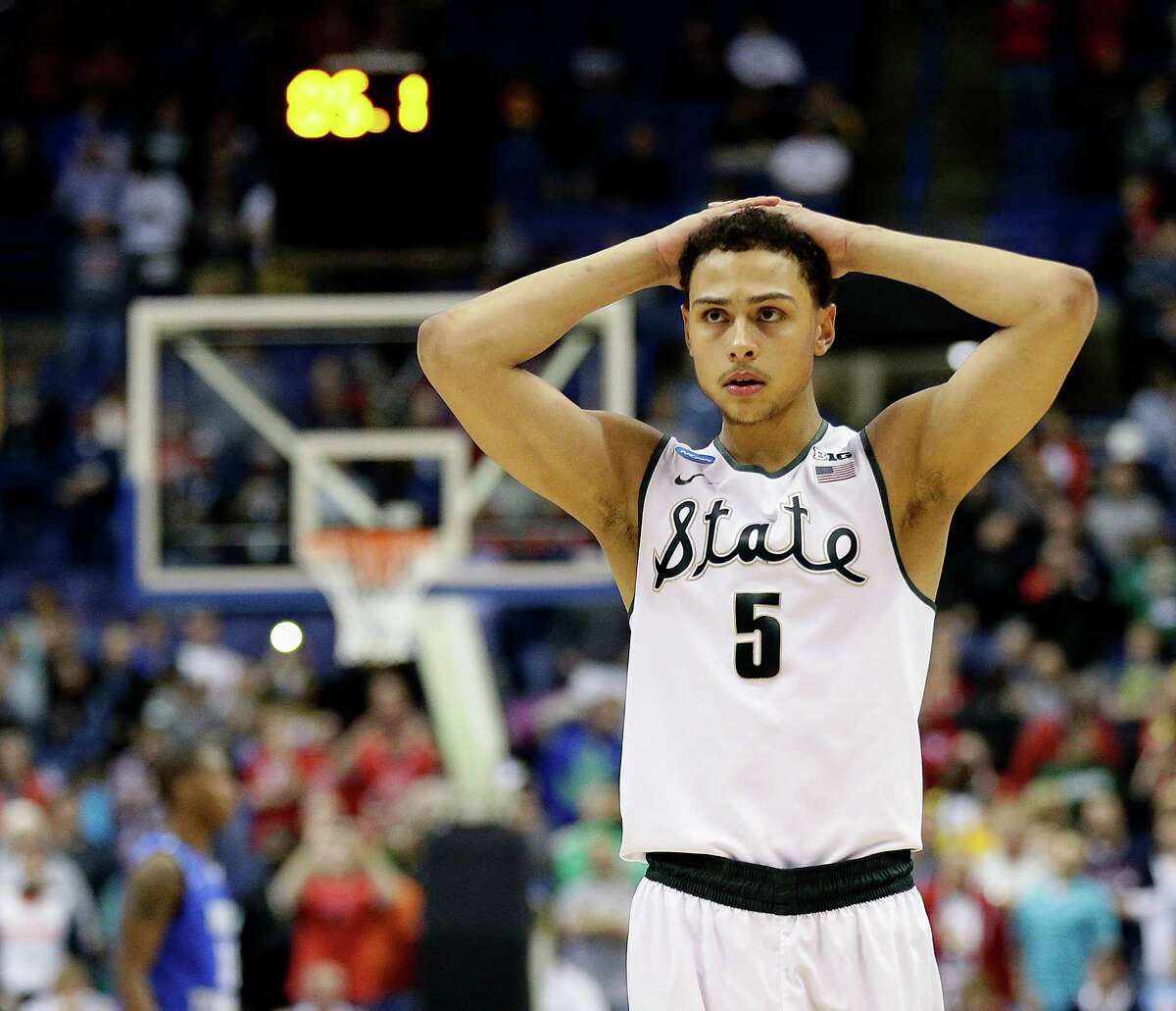 Michigan State’s Bryn Forbes watches as Middle Tennessee prepares to shoot a free throw in the final moments of a first-round NCAA Tournament game on March 18, 2016, in St. Louis.