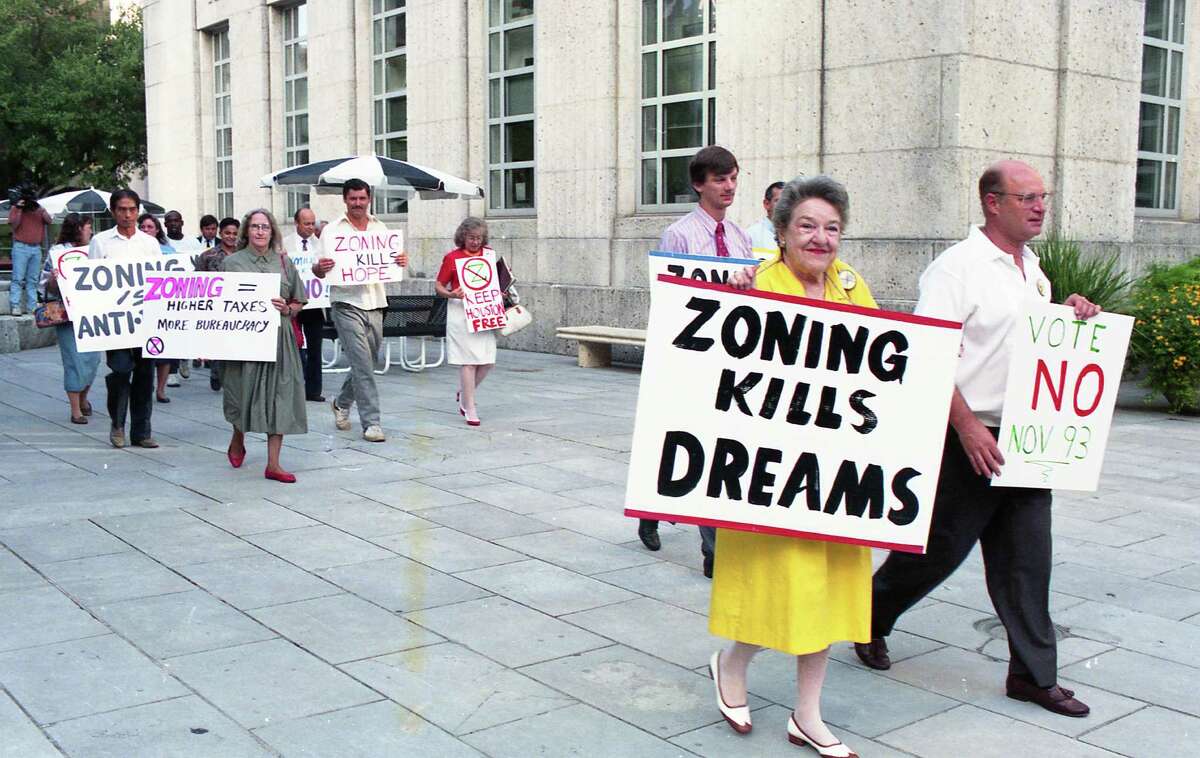 08/24/1993 - Anti-zoning group holds demonstration around Houston City Hall against the proposed Houston zoning ordinance city council is considering on Wednesday.