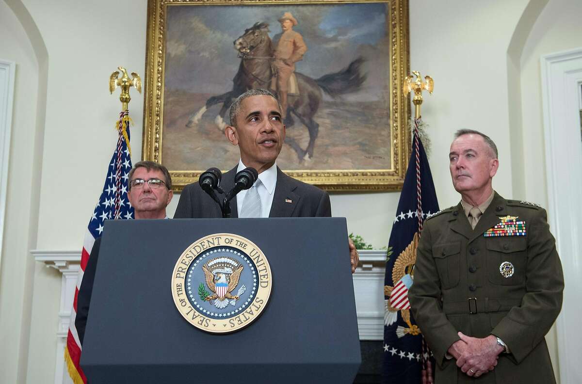 US President Barack Obama delivers a statement on Afghanistan with Defense Secretary Ashton Carter (L) and the Chairman of the Joint Chiefs of Staff Gen. Joseph Dunford at the White House in Washington, DC, on July 6, 2016. Obama announced that 8,400 US troops will remain in Afghanistan into 2017 in light of the still "precarious" security situation in the war-ravaged country. / AFP PHOTO / NICHOLAS KAMMNICHOLAS KAMM/AFP/Getty Images