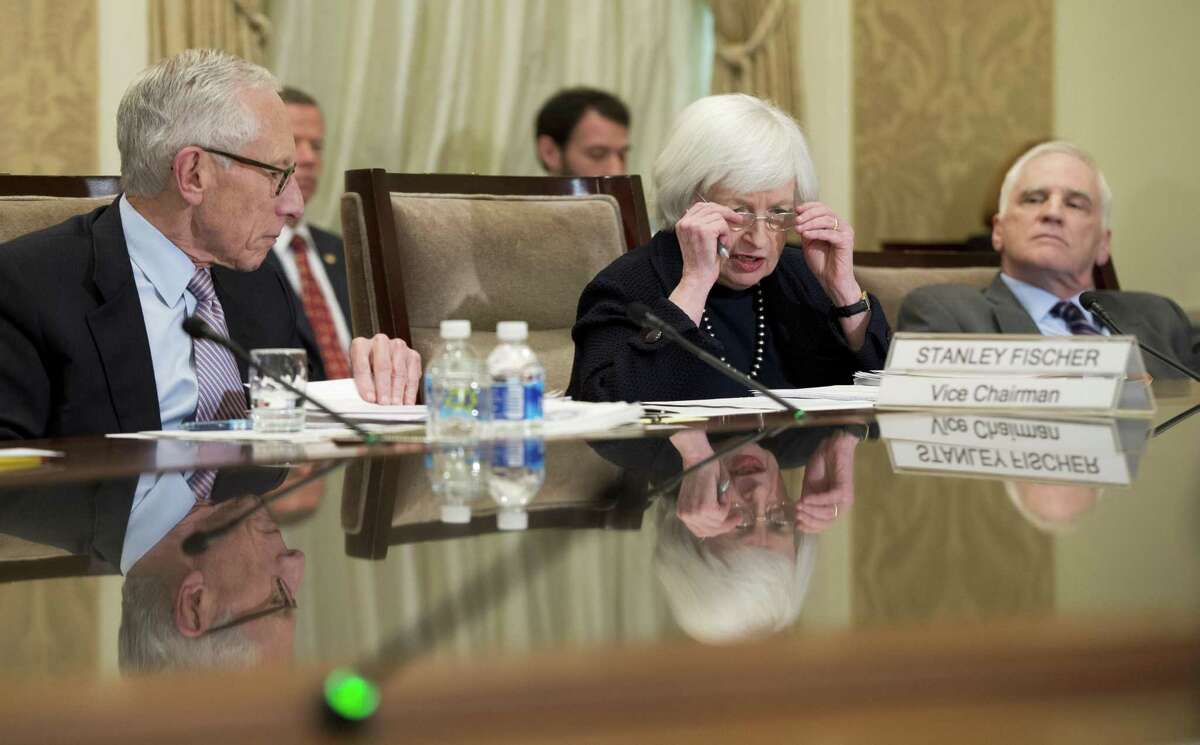 Daniel Tarullo (right), shown with Vice Chairman Stanley Fischer and Chair Janet Yellen, plans to step down in early April. Tarullo spearheaded the U.S. government’s aggressive push to make banks safer after the 2008 financial crisis.