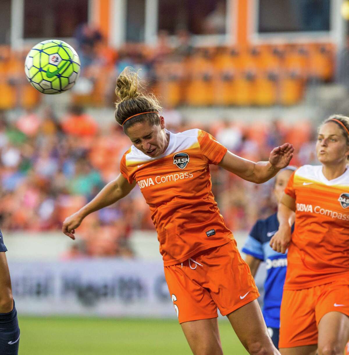 Houston Dash midfielder Morgan Brian (6) head butts the ball away from FC Kansas City defender Brittany Taylor (13) from scoring during the first half of action between the Houston Dash and the FC Kansas City during a soccer game at BBVA Compass, Sunday, June 19, 2016, in Houston.
