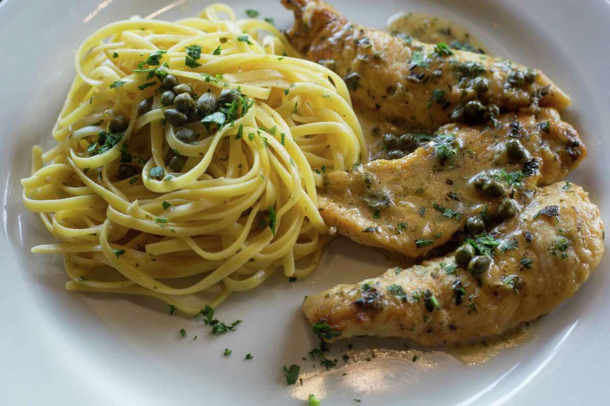 The Petto Di Pollo Piccata is a pan-sauteed chicken breast in a white wine butter-citrus sauce with capers. Here, it’s served with pasta in garlic and olive oil.