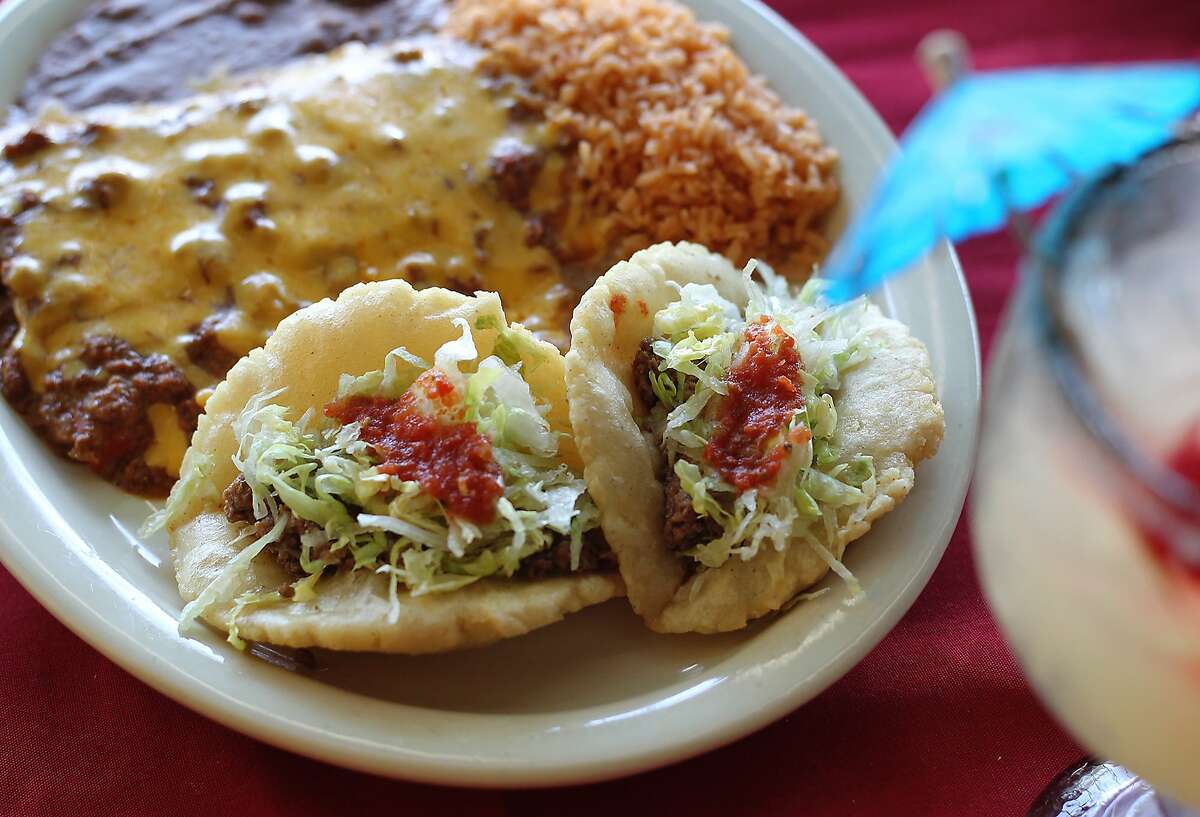 Restaurant Jacala.  Pictured is dinner platter #3 with two puffy tacos, three cheese enchiladas with chili and served with rice and refried beans.  Kin Man Hui/kmhui@express-news.net