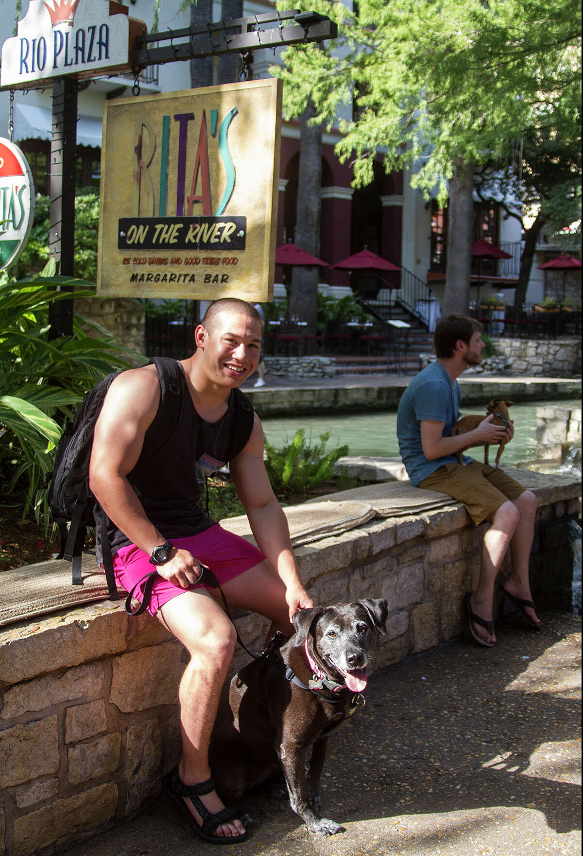 Antonio Zavala and his dog, Chloe, sit outside Rita's on the River, which was voted best Pet-Friendly Restaurant in Readers’ Choice.