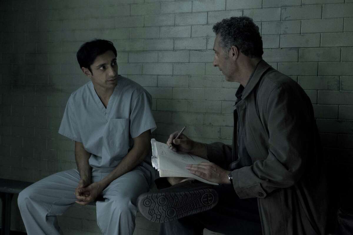Murder suspect Naz (Riz Ahmed) confers with attorney (John Turturro as John Stone) in HBO’s murder drama “ The Night Of.” In it, a youth falls, little by little, into a nightmarish case of homicide.