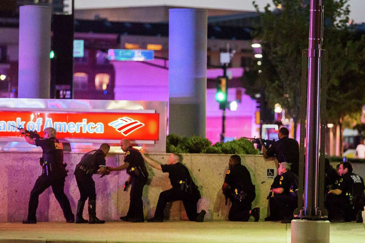 Five police officers were fatally shot by two snipers at "elevated positions" during peaceful protests held in downtown Dallas on Thursday night in response to recent police shootings involving black men in Baton Rouge, La. and St. Paul, Minn.