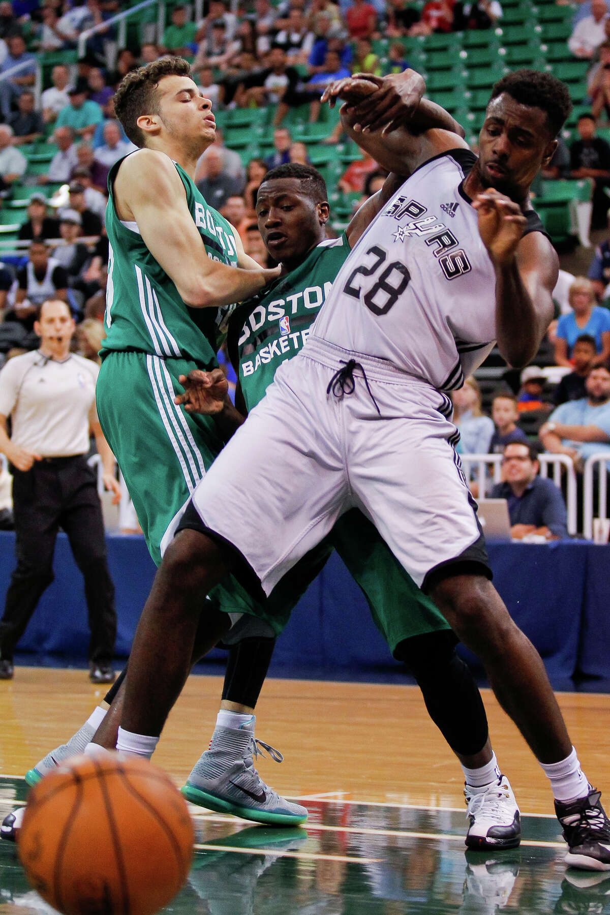 A foul is called on Boston’s Terry Rozier as he and the Spurs’ Livio Jean-Charles compete for a rebound during an NBA Summer League game on July 9, 2015 at EnergySolutions Arena in Salt Lake City.