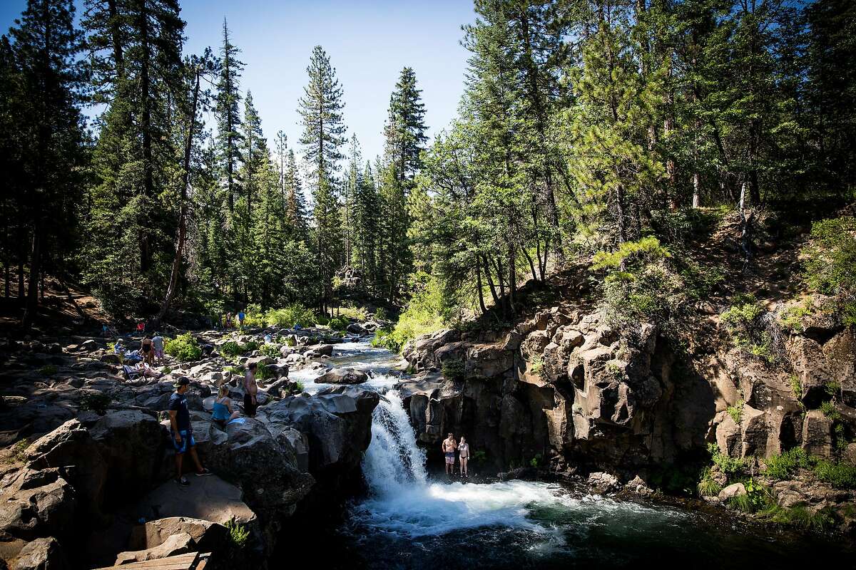 Visitors swim below Lower Falls on the McCloud River near McCloud, California, June 29, 2016.