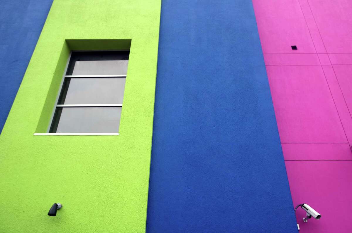 Located in the building that formerly housed the Museo Alameda, this was the Texas A&M-San Antonio Educational & Cultural Arts Center as seen Tuesday March 10, 2015, recently got a facelift. The center added cobalt blue and lime green accents to the signature hot pink that still dominates the structure's facade.