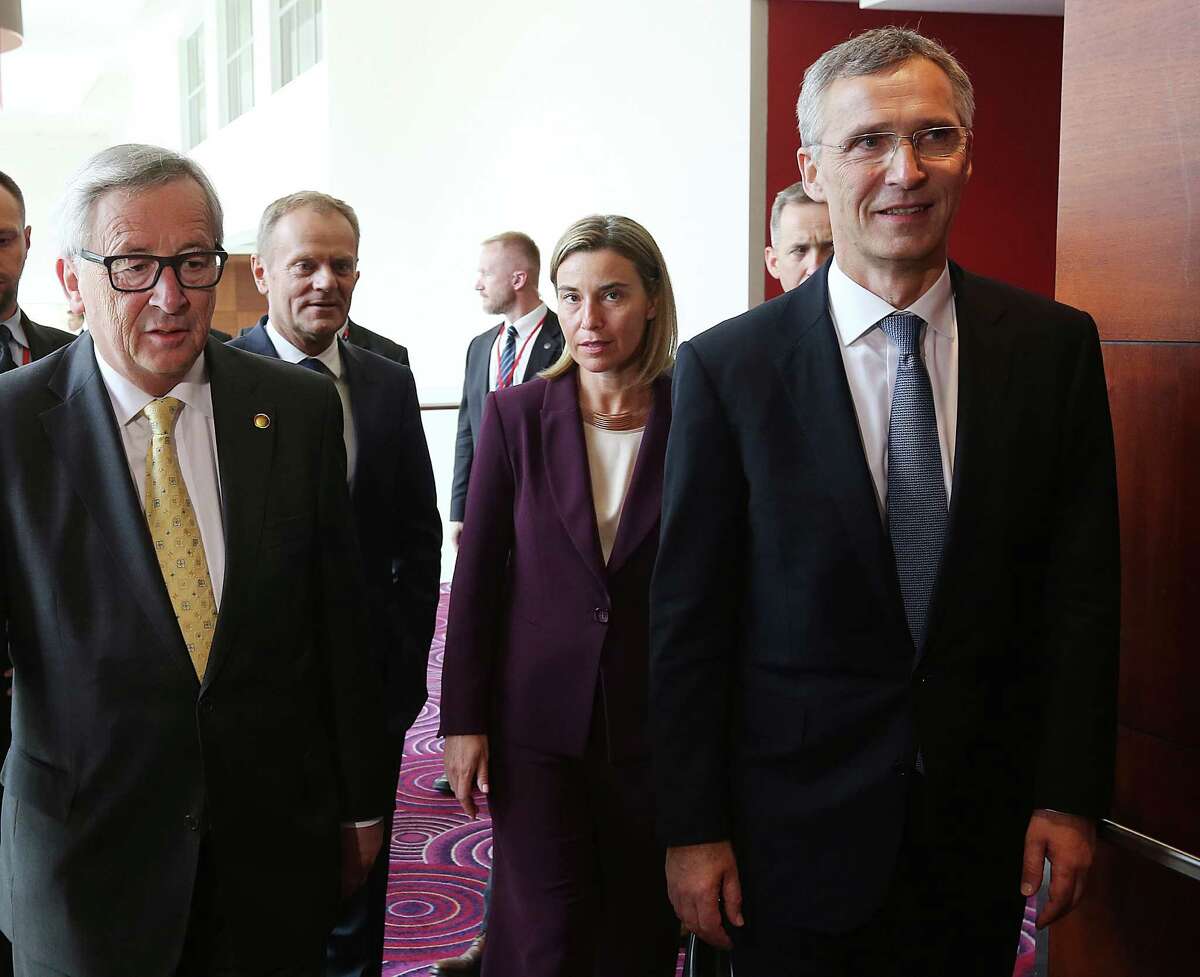 President of European Commission Jean-Claude Juncker, left, President of the European Council Donald Tusk, second left, chief of European Foreign Policy Federica Mogherini, second right, and NATO Secretary General Jens Stoltenberg, right, arrive for a EU Signing Ceremony of the EU-NATO Joint Declaration during the NATO summit in Warsaw, Poland, Friday, July 8, 2016.(AP Photo/Czarek Sokolowski)