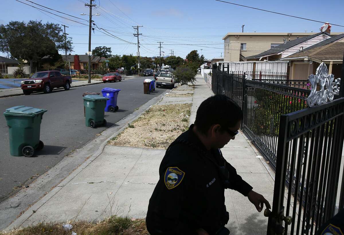 Ruben Munguia leaves the home of a mother whose daughter had run away a few days prior after helping a colleague translate from Spanish to English during Munguia's shift July 7, 2016 in Richmond, Calif.