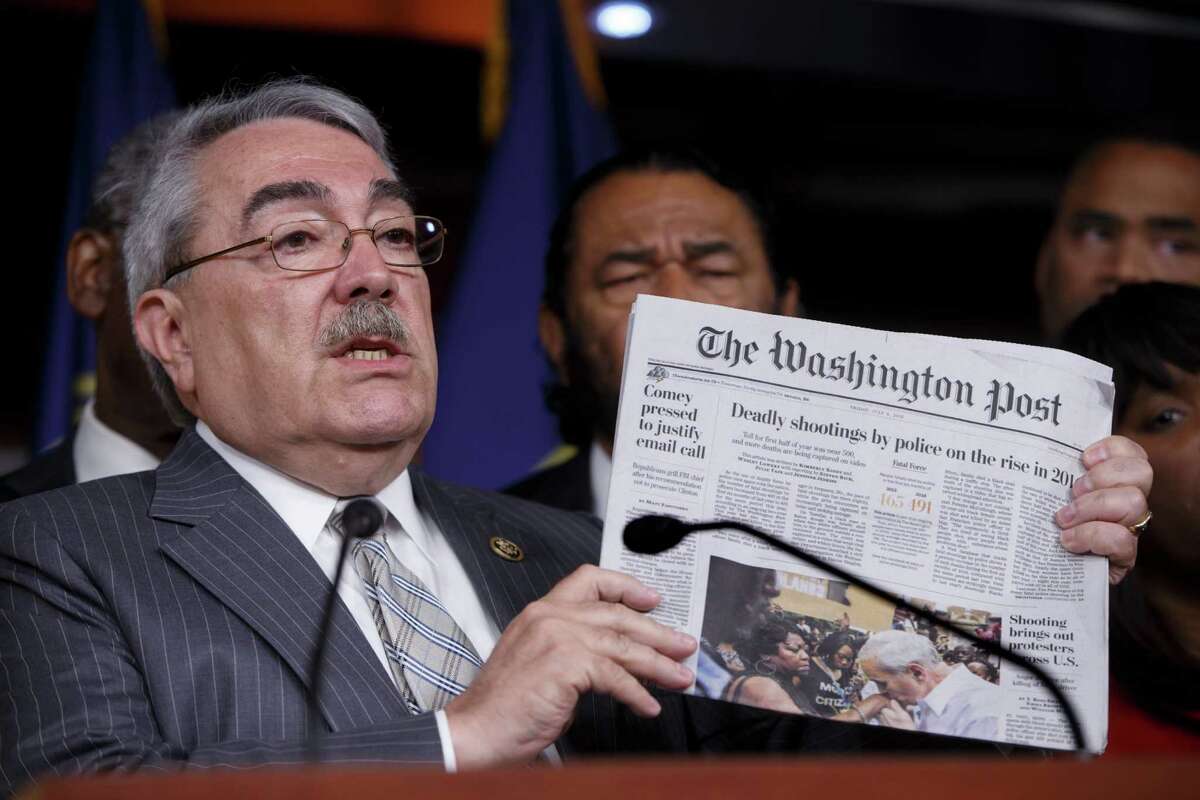 Congressional Black Caucus Chairman Rep. G. K. Butterfield﻿ displays ﻿a front page story ﻿about the rise of fatal police shootings during a news conference on Capitol Hill ﻿Friday.﻿