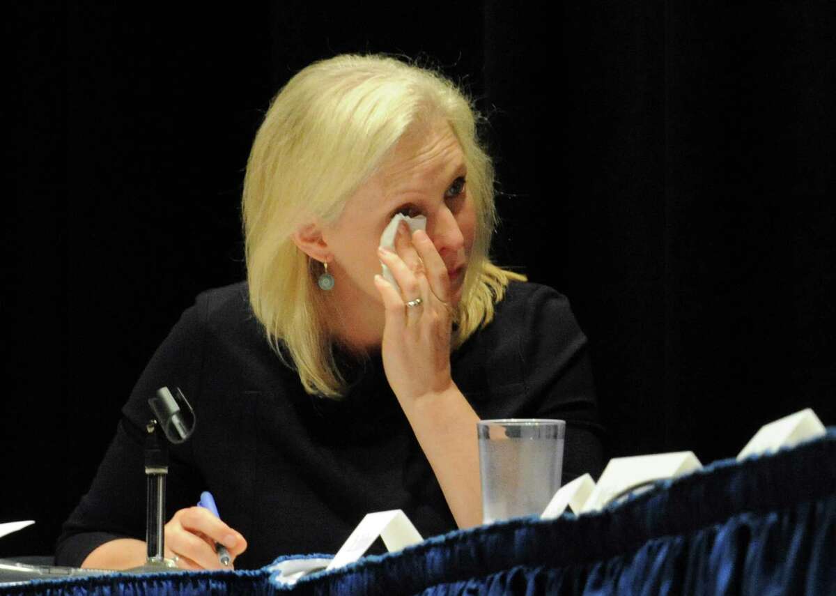 U.S. Senator Kirsten Gillibrand wipes tears from her eyes as she listens to Hoosick resident Emily Mapes tell how the PFOA contamination has personally impacted her life during a roundtable discussion at Hoosick Falls Central School on Friday July 8, 2016 in Hoosick falls, N.Y. (Michael P. Farrell/Times Union)