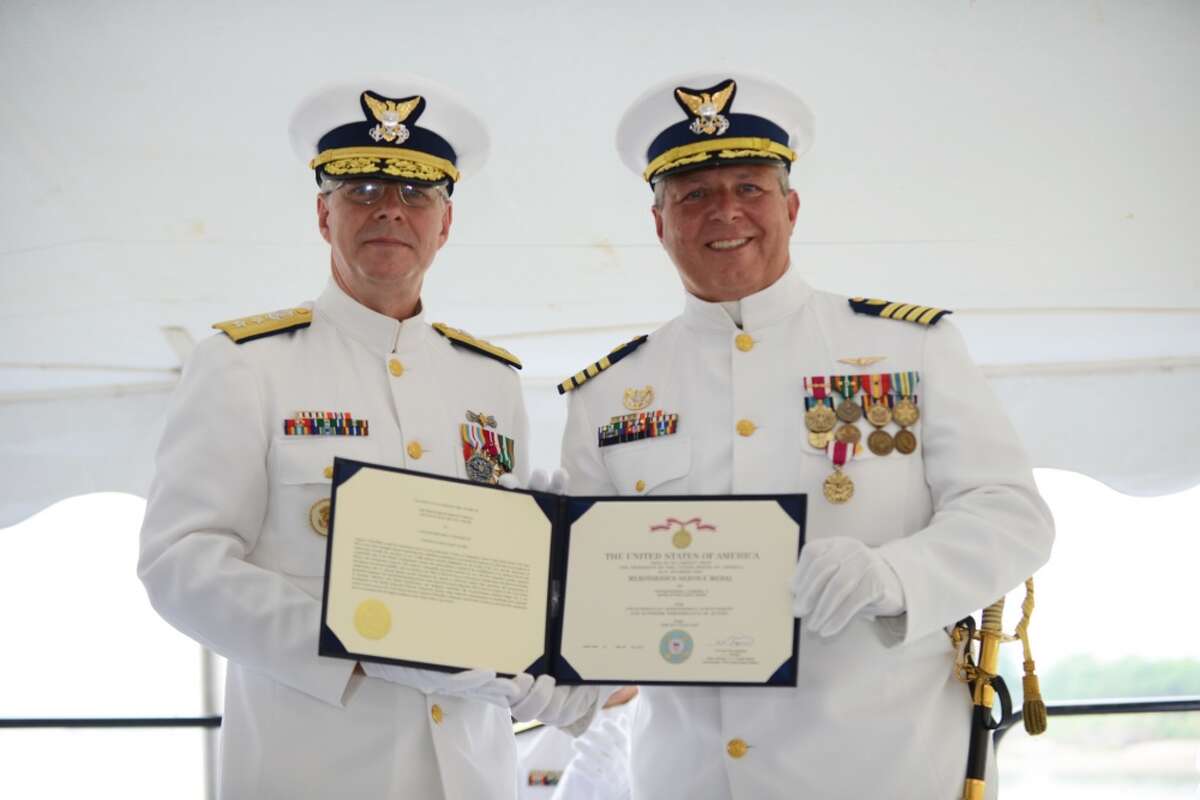 Rear Adm. Steven Poulin, commander Coast Guard First District, recognizes Capt. Edward Cubanski, commanding officer of Coast Guard Sector Long Island Sound, for his service during a change of command ceremony, July 8, 2016. The ceremony is a formal, time-honored tradition of the maritime service.
