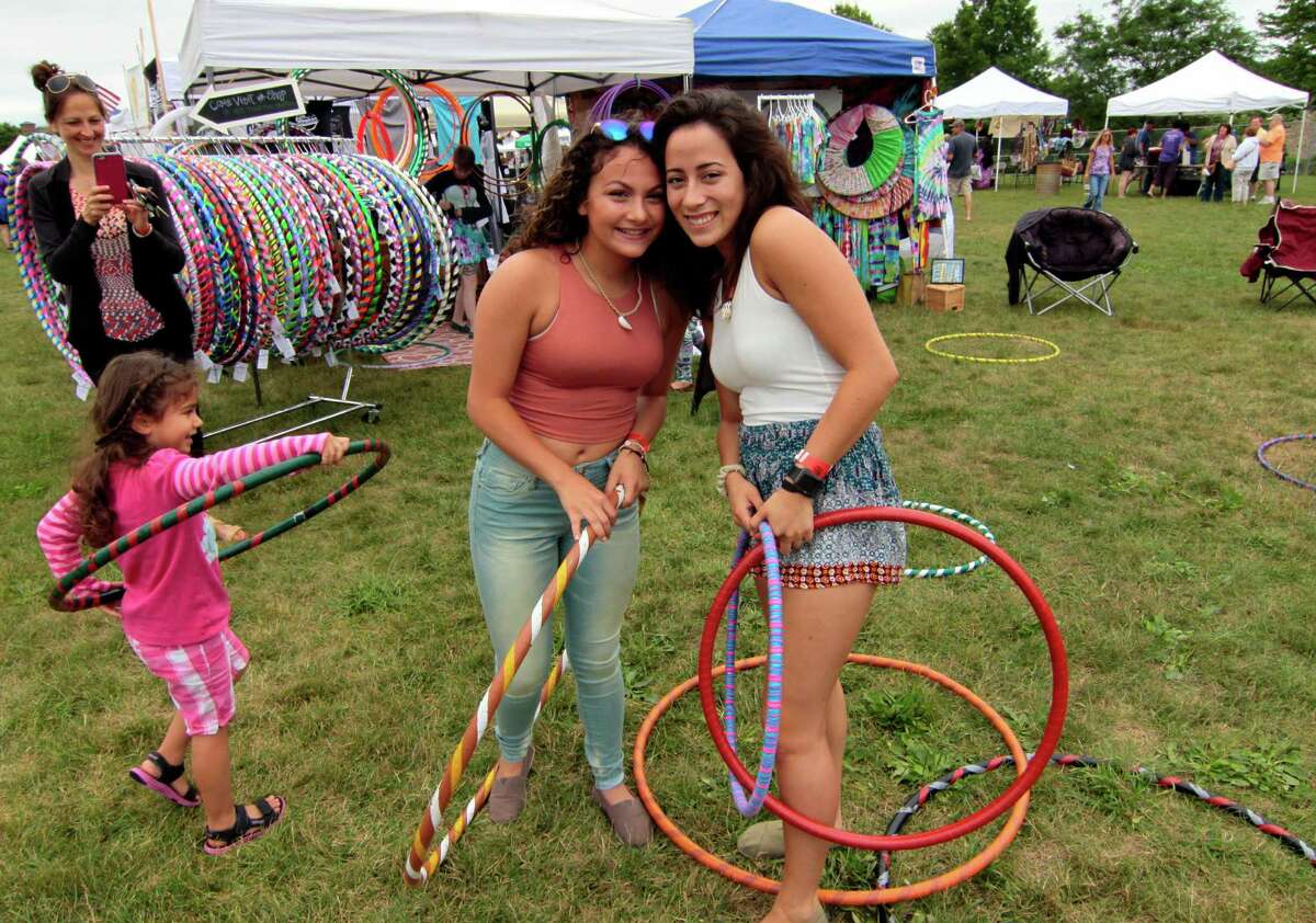 Sabrina Maldonado and her friend Christina Hernandez, at right, enjoy the 7th Annual Soupstock Music and Arts Festival in Shelton, Conn. on Saturday July 9, 2016. Soupstock features 2 stages of live music, a chili competition on Sunday, Kids Zone, over 50 handmade artisans, an Artisan Expo Pavilion, a variety of food trucks and more. The festival continues on Sunday from 11 a.m. to 8 p.m.