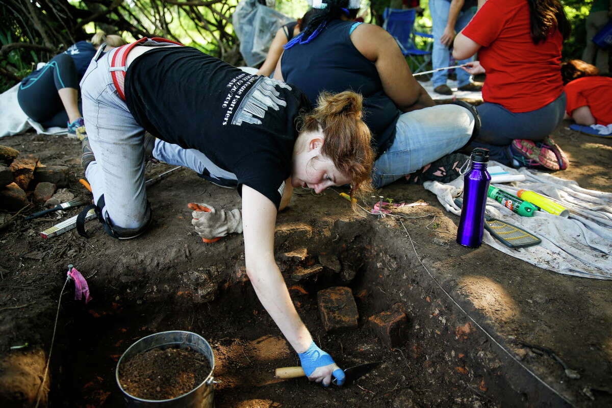 University of Houston student Allison Holmes removes dirt to uncover part of the sugar mill at the Levi Jordan Plantation Tuesday, June 28, 2016 in Brazoria.