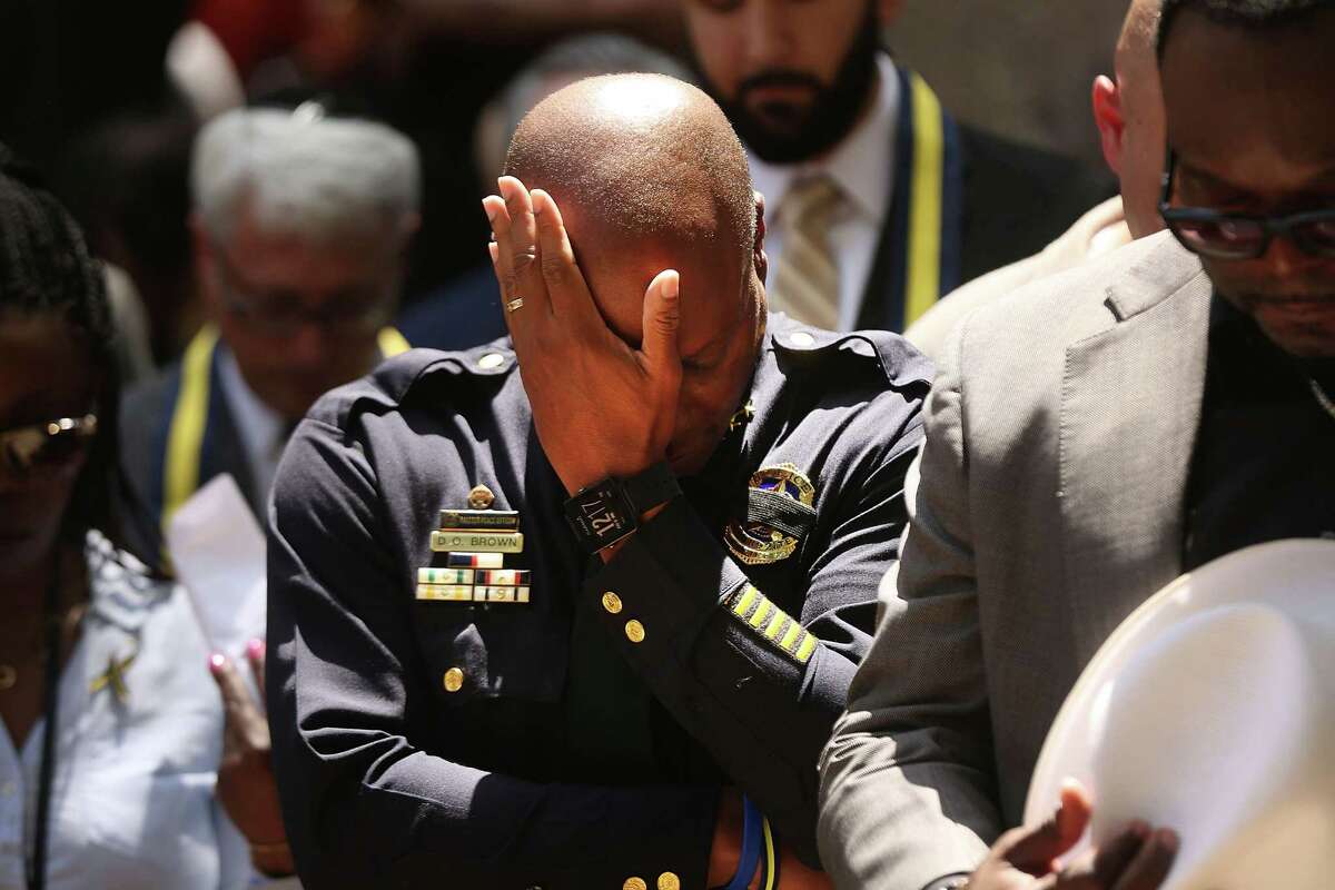 ﻿Dallas Police Chief David Brown pauses at a prayer vigil following the deaths of five police officers. In the aftermath, Brown said that police "don't feel much support most days." ﻿