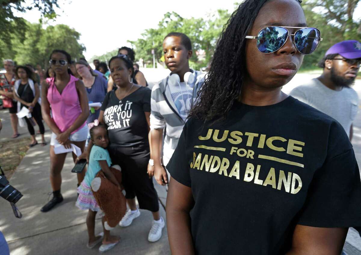 Andrea Jackson, right, of Houston, and and others ﻿commemorate the first anniversary of the arrest of Sandra Bland Sunday﻿. Three days after her arrest, she was found hanging dead in her Waller County jail cell. Her death was ruled as a suicide﻿ but sparked nationwide outrage.