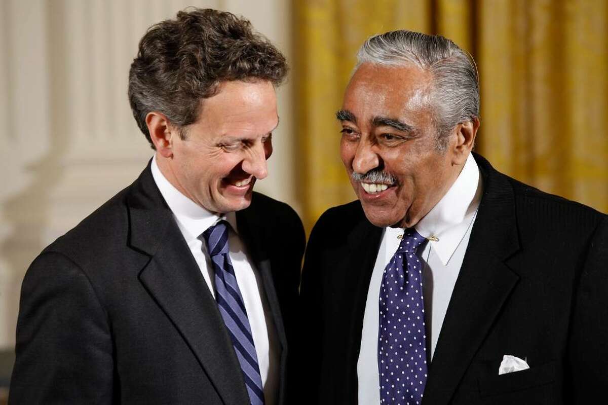 WASHINGTON - APRIL 26: Treasury Secreatary Timothy Geithner (L) and Rep. Charles Rangel (D-NY) share a laugh before a ceremony recognizing the World Series champion New York Yankees in the East Room of the White House April 26, 2010 in Washington, DC. President Barack Obama welcomed the Yankees to the White House for a ceremony celebrating their 2009 championship. (Photo by Chip Somodevilla/Getty Images) *** Local Caption *** Charles Rangel;Timothy Geithner