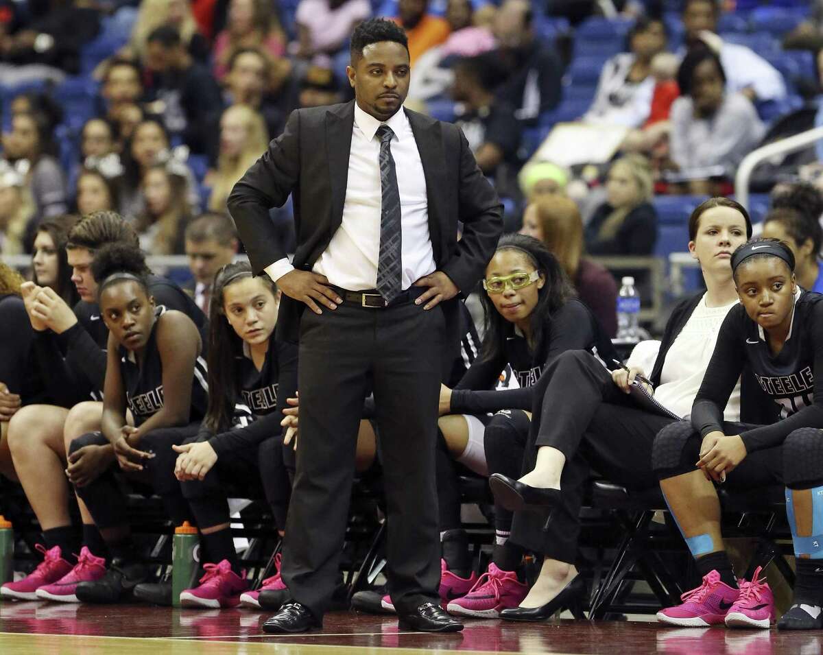 Steele coach Jeffery Chatman and players watch first-half action during their Class 6A state semifinal against Duncanville on March 4, 2016 at the Alamodome.