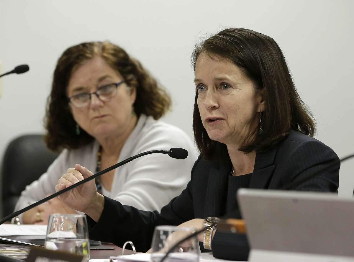 Jodi Remke, right, chairwoman of the Fair Political Practices Commission, discusses a proposed rule change to curb unreported lobbying, as commission member Patricia Wynne, left, looks on Thursday, March 17, 2016, in Sacramento, Calif. The commission voted 3-1 to revise the rule that allows some people to lobby state officials but duck reporting requirements. (AP Photo/Rich Pedroncelli)