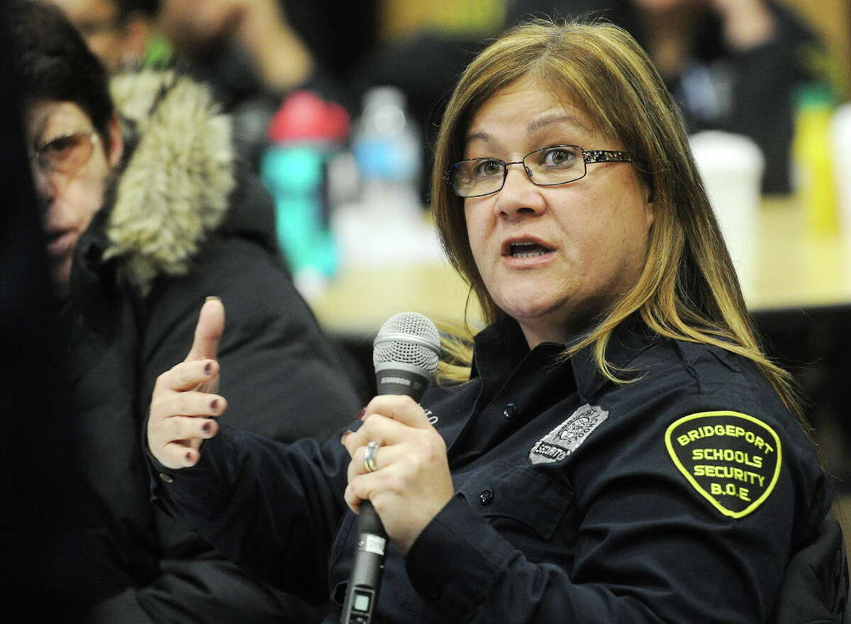 Discovery Magnet School security guard Marilyn Carasquillo relates a story during cultural competency training for Bridgeport school security officers at the Fairchild Wheeler Magnet School in Bridgeport, Conn. on Wednesday, January 6, 2016.