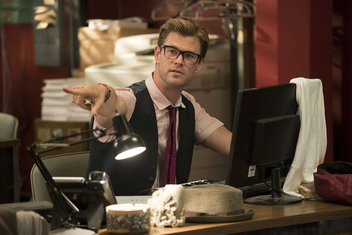 This image released by Sony Pictures shows Chris Hemsworth in a scene from "Ghostbusters," opening nationwide on July 15. (Hopper Stone/Columbia Pictures/Sony Pictures via AP)