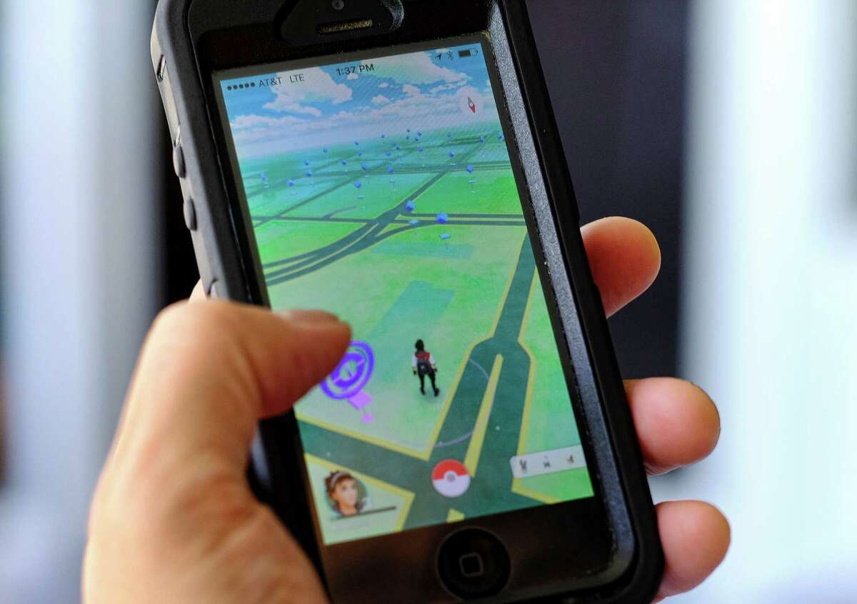 Pokémon Go players search for ﻿digital monsters using a smartphone app.﻿