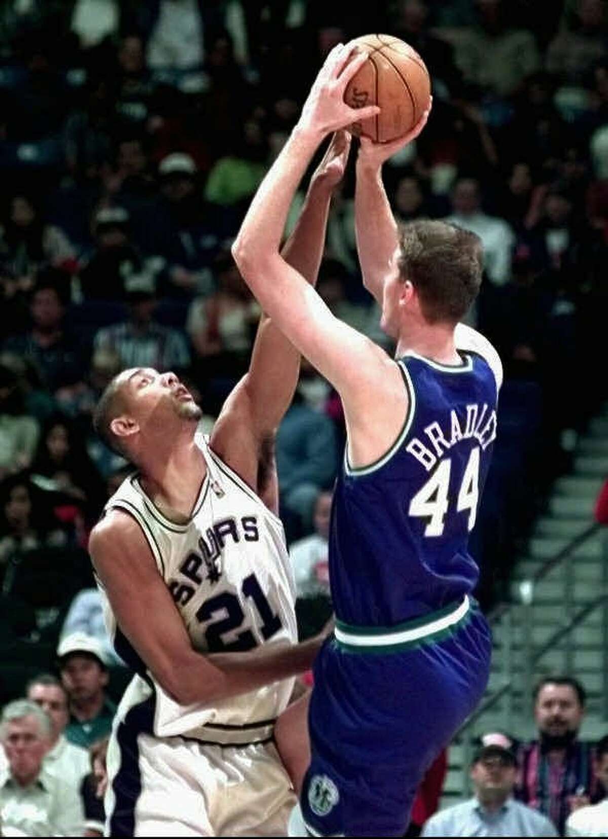 San Antonio Spurs Tim Duncan (21) blocks the attempted shot by Dallas Mavericks center Shawn Bradley (44) during first quarter action of their preseason game at the Alamodome in San Antonio , Wednesday Oct. 22, 1997. (Express-News,Doug Sehres)