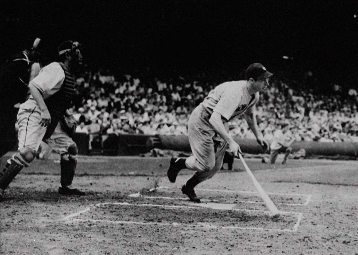 Yankee outfielder Joe DiMaggio singles in the first inning of a game with the Cleveland Indians at Cleveland, in this July 16, 1941, photo. It was the 56th straight game in which he got a hit. Every so often, a hitter pieces together a streak, 10 games, 20 games, maybe even 30. And that's when people start thinking about the summer of 1941, when Joe DiMaggio hit in 56 straight. (AP Photo/File)
