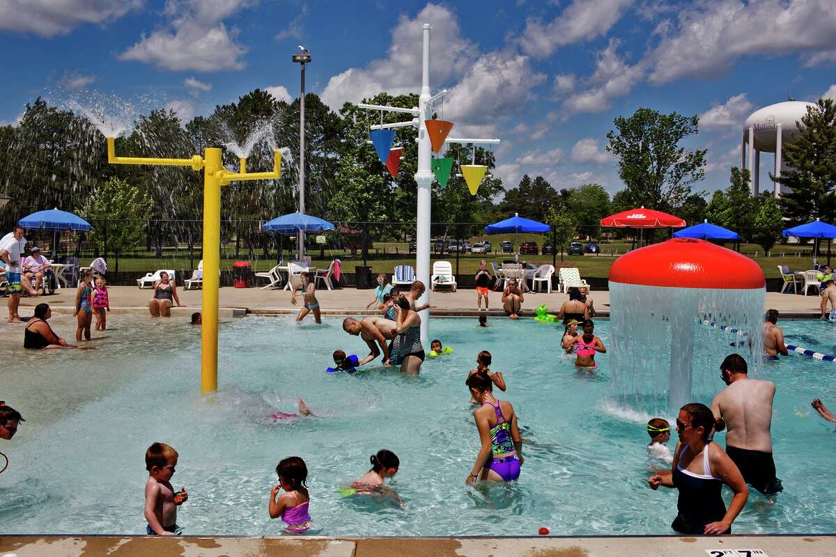 Patrons at the pool enjoy a splash on opening day at the Plymouth Park Pool on Saturday.