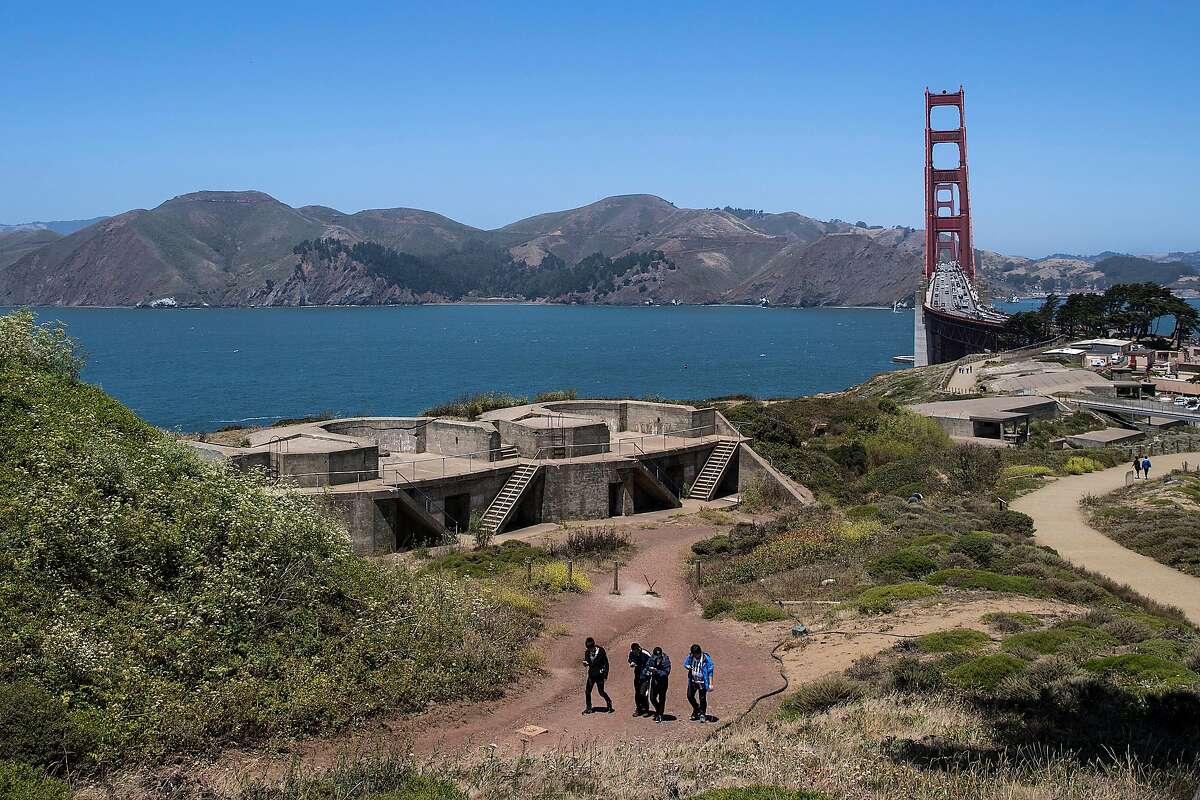 A group of tourists walk past Battery Godfrey at the Presidio in San Francisco, Calif. on Tuesday, July 12, 2016.