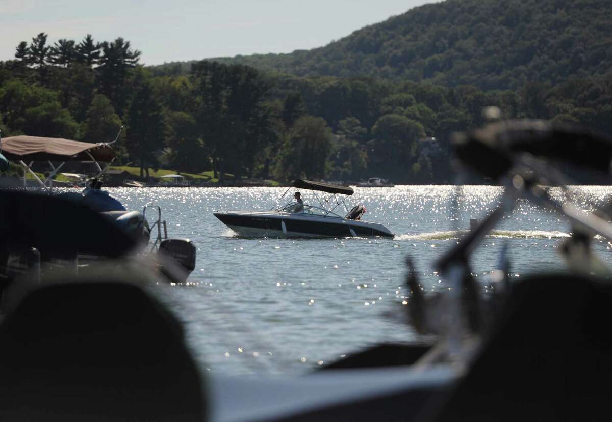 File photo of a boater returning to the docks at Echo Bay Marina on Candlewood Lake in Danbury, Conn. Friday, Sept. 12, 2014.