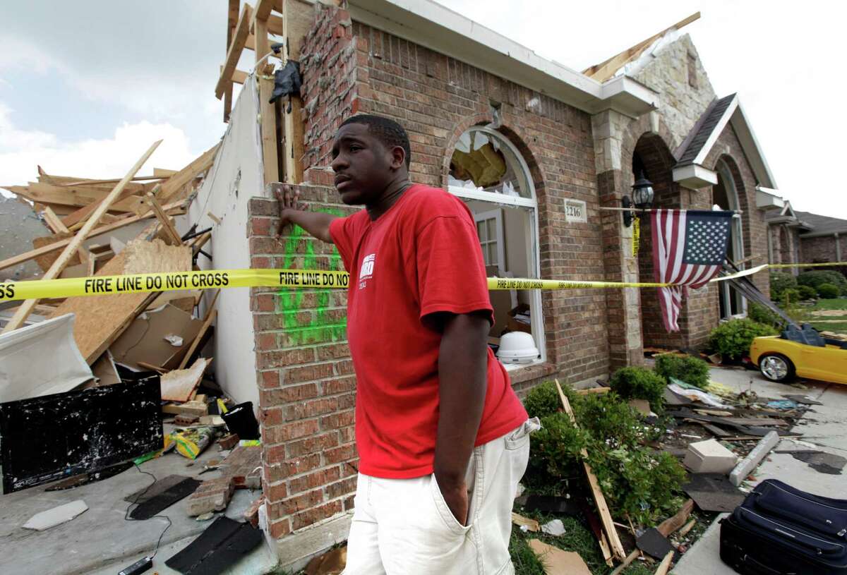 Royal Thornton waits at his tornado-damaged house in Forney in 2012. Home insurance changes may be ahead. was hit by a tornado that left just the front part of the home standing. The mayor of Forney, Texas, says it's "a real blessing" that nobody was killed in the community by the tornadoes that ripped through parts of the Dallas area yesterday.
