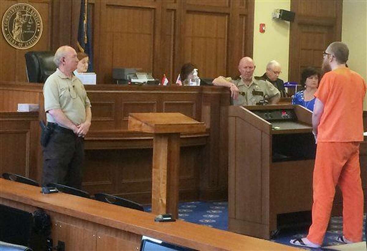 The Reverend, a 35-year-old self-avowed Satanist accused of killing his elderly roommate at a Kentucky nursing home speaks to a judge Wednesday, March 2, 2016, Scottsville, Ky. The judge advised that The Reverend shouldn’t make a statement and ordered The Reverend, who legally changed his name from Robert Reynolds, to undergo a mental evaluation before the case against him can continue.