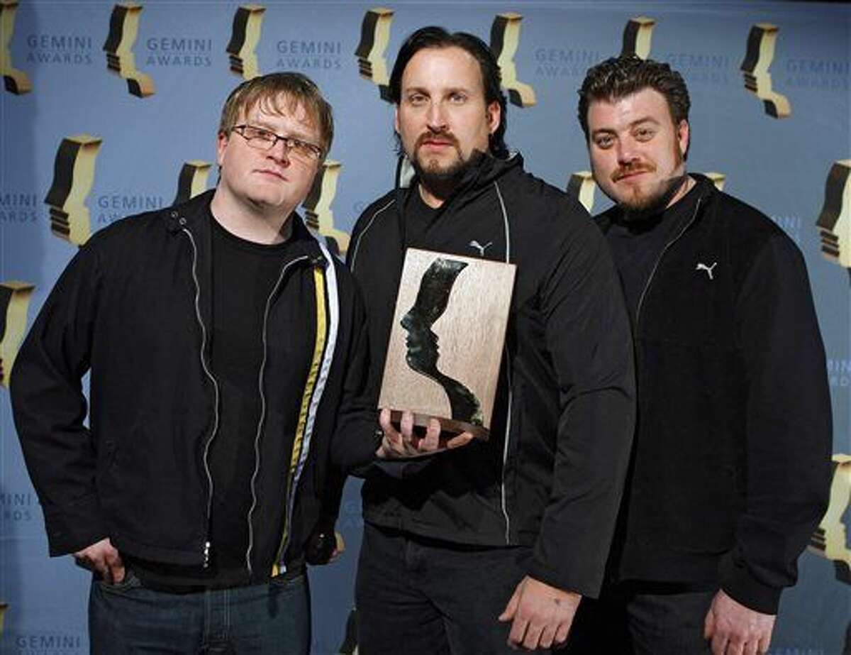 "Trailer Park Boys" cast members, left to right, Michael Smith, John Paul Tremblay and Robb Wells, hold their achievement award at the 24th annual Gemini Awards in Calgary. Smith was arrested in Los Angeles on suspicion of misdemeanor battery.