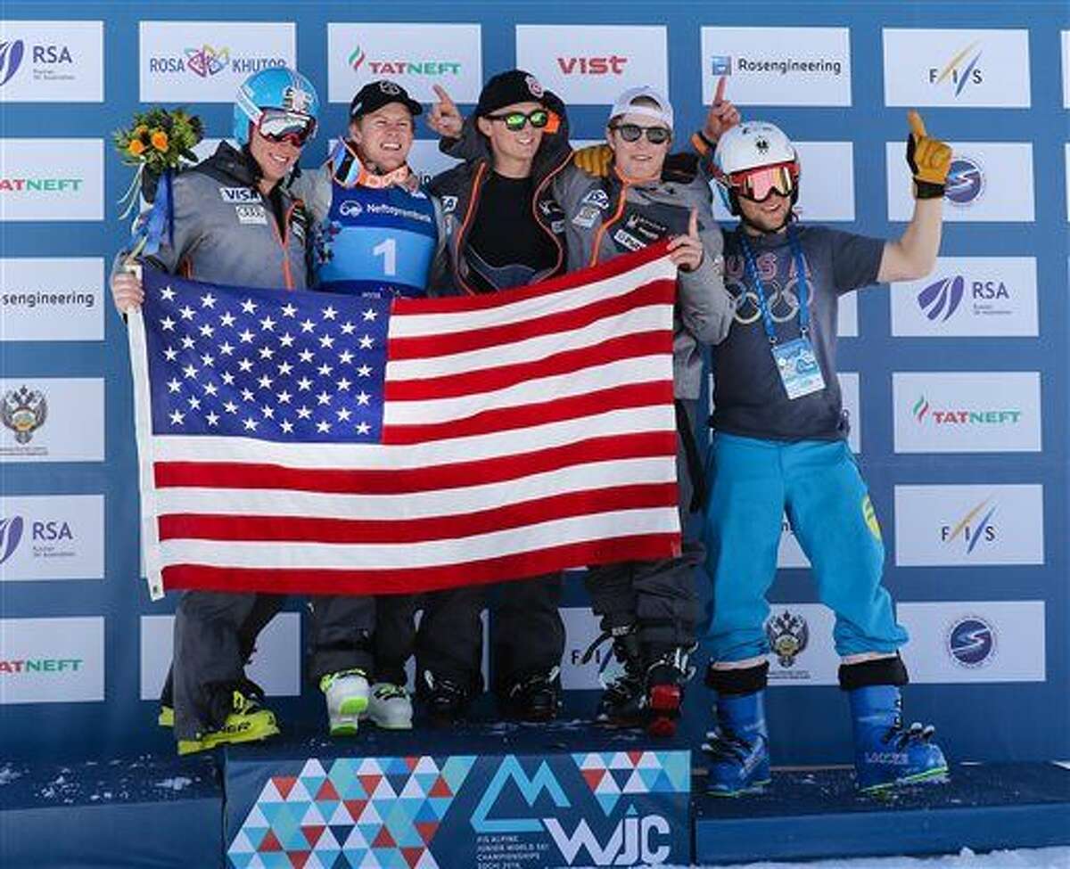 In this Feb. 27 photo provided by the United States Ski and Snowboard Association, from left, Sam Morse, Eric Arvidsson, Drew Duffy, Patrick Kenney and Florian Szwebel celebrate at the FIS Alpine Junior World Ski Championship in Sochi, Russia. World junior downhill champion Erik Arvidsson somehow skied off to the side as an avalanche rumbled toward his group just over a year ago in Soelden, Austria. Same with teammate Drew Duffy. Two of their good friends, highly touted skiing prospects Bryce Astle and Ronnie Berlack, were killed in the slide.