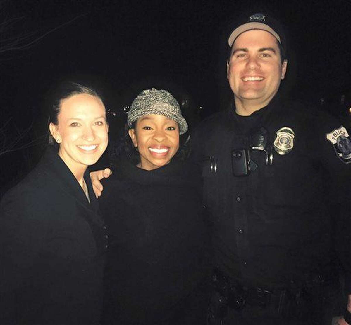 This photo provided by officer Paul Rogerson of the shows Rogerson, right, of the Pleasant Grove Police Department in Utah, singer Gladys Knight, center, and Rogerson's wife, left. 