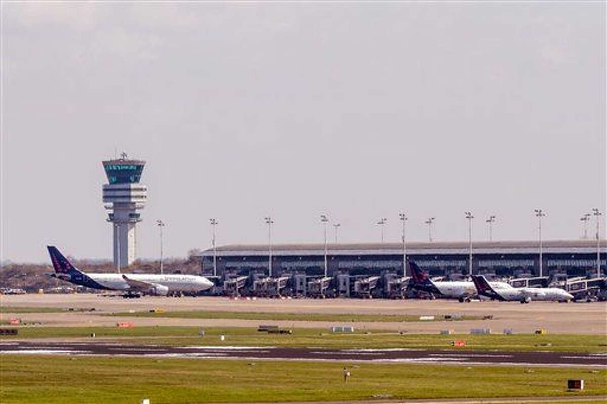 Three Brussels Airlines planes stand at departure gates at Brussels Airport, in Zaventem, Belgium, Sunday. The first flight since the terrorist bombings March 22 has taken off.