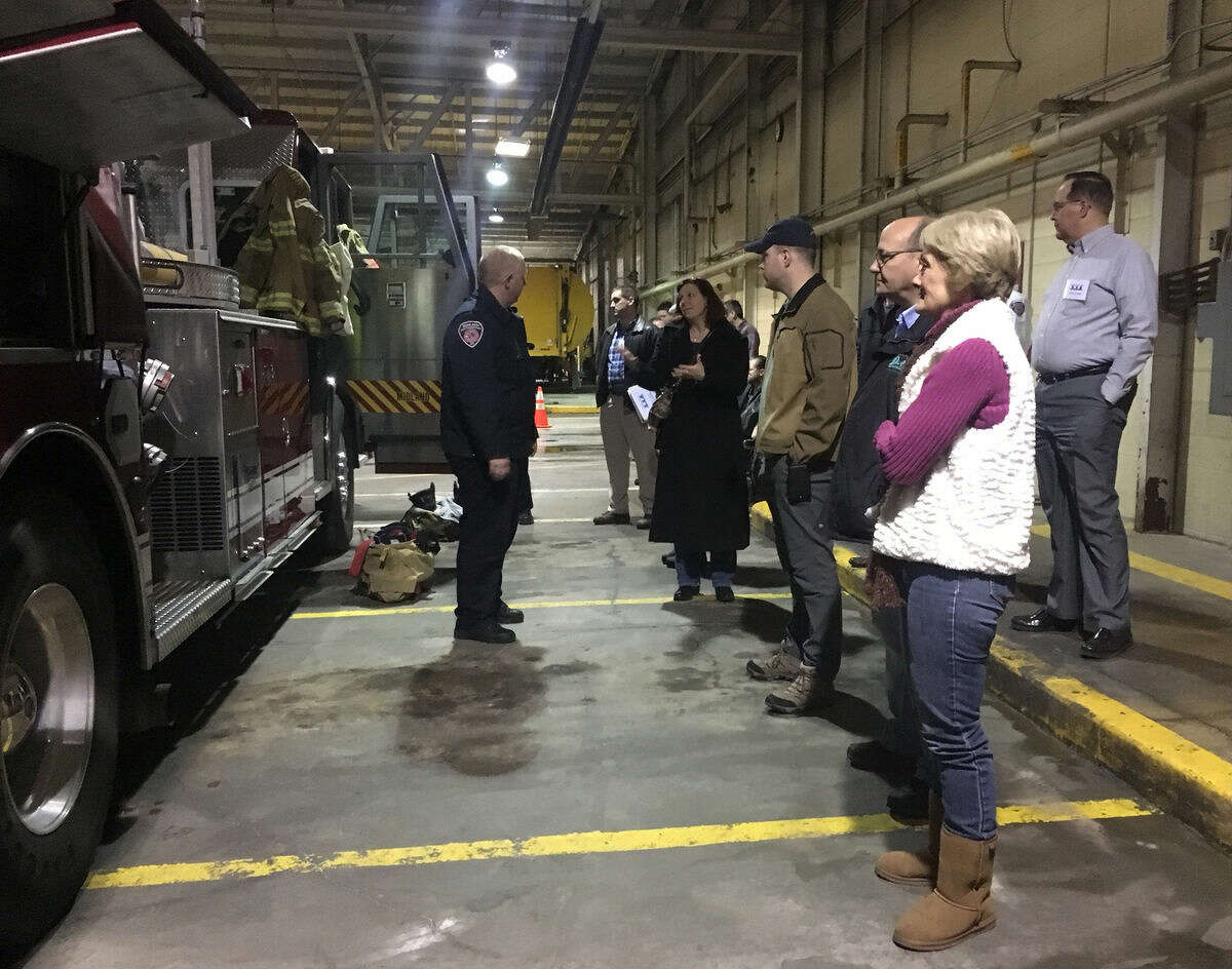 Citizen’s Academy participants learn about the different uses and tools included in the Station 1 fire truck.