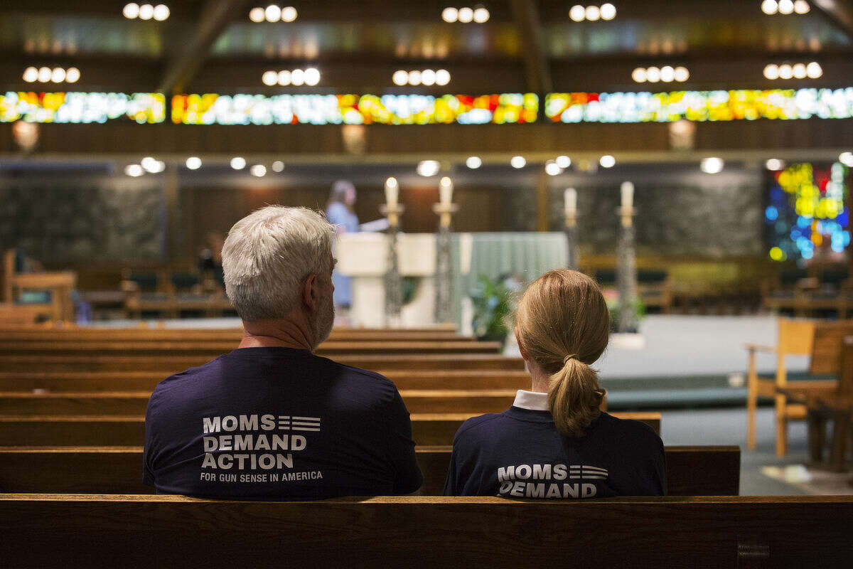 Sanford residents John Kinkema and Kathy Kinkema sit during a prayer vigil at the Blessed Sacrament Church on Wednesday. Moms Demand Action For Gun Sense in America, is a non-partisan movement of Americans demanding  solutions to address our nation’s culture of gun violence.