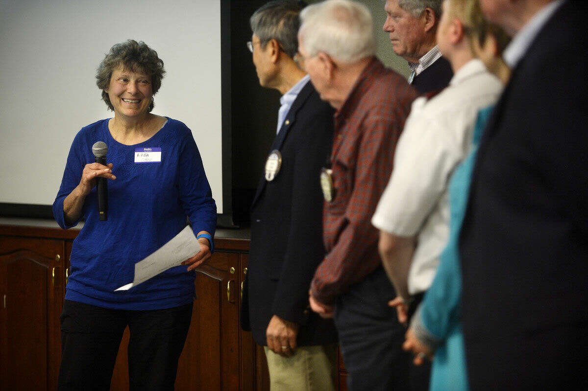 Board of Director for ACT Uganda and head of the H.E.A.L Project Lisa Corso, left, thanks members of Kiwassee Kiwanis for a $5,000 grant on Wednesday at Trinity Lutheran Church.