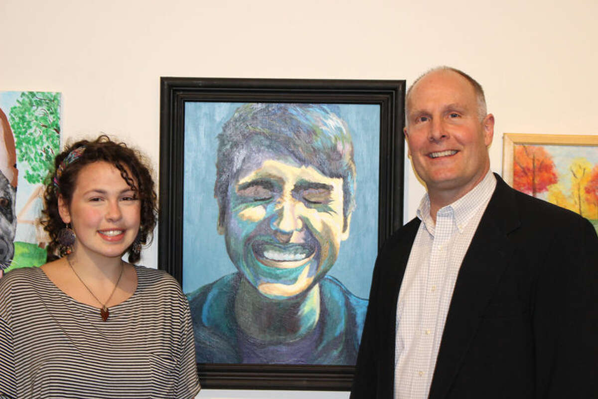 Congressman John Moolenaar is shown with H.H. Dow High School student Natalie Laurin at the Midland Center for the Arts. Laurin’s acrylic painting, “Caleb,” was chosen as winner of the 2016 Congressional Art Competition for Michigan’s Fourth Congressional District.