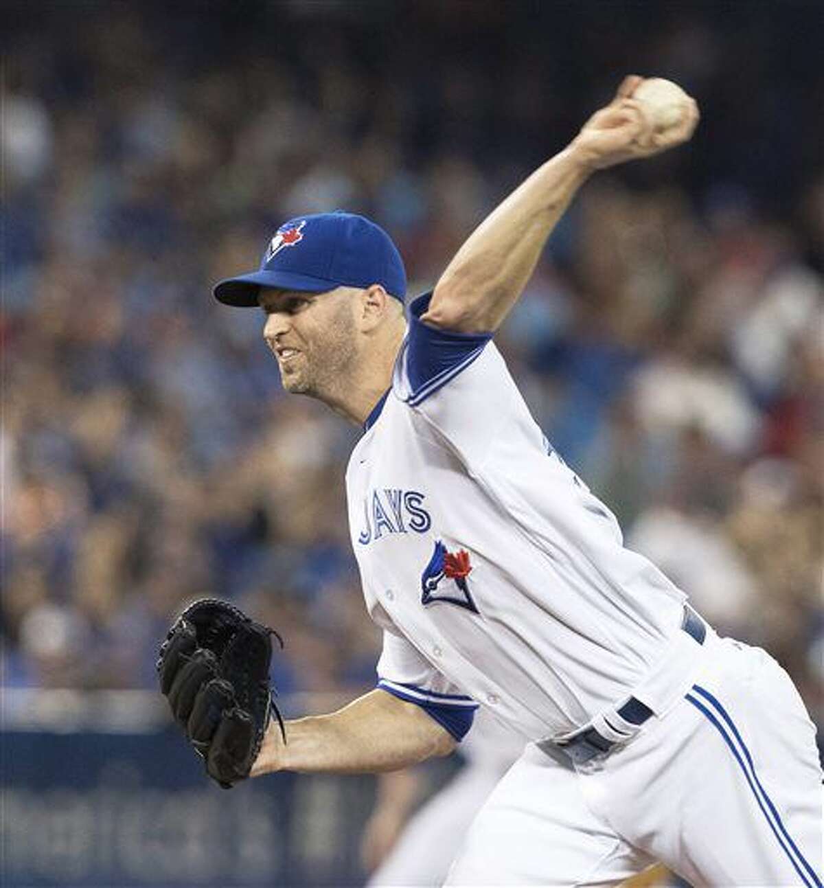 Toronto Blue Jays starting pitcher J.A. Happ throws against the Detroit Tigers during the first inning of a baseball game in Toronto, Friday July 8, 2016. (Fred Thornhill/The Canadian Press via AP)