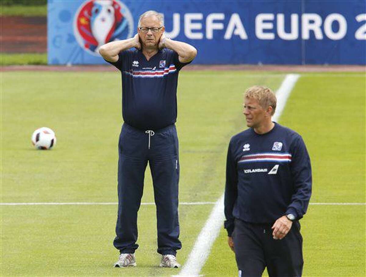 Coaches Lars Lagerbaeck, left, and Haimir Hallgrimsson attend a training session of Iceland's national soccer team at their base camp in Annecy, France, Thursday, June 30, 2016. Iceland will face France in a Euro 2016 quarterfinal match in Paris on Sunday, July 3, 2016.(AP Photo/Michael Probst)