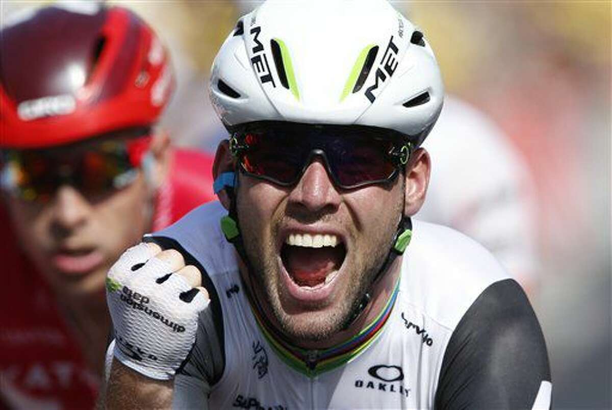 Britain’s Mark Cavendish celebrates as he crosses the finish line to win the sixth stage of the Tour de France cycling race over 190.5 kilometers (118.1 miles) with start in Arpajon-sur-Cere and finish in Montauban, France, Thursday, July 7, 2016. (AP Photo/Christophe Ena)