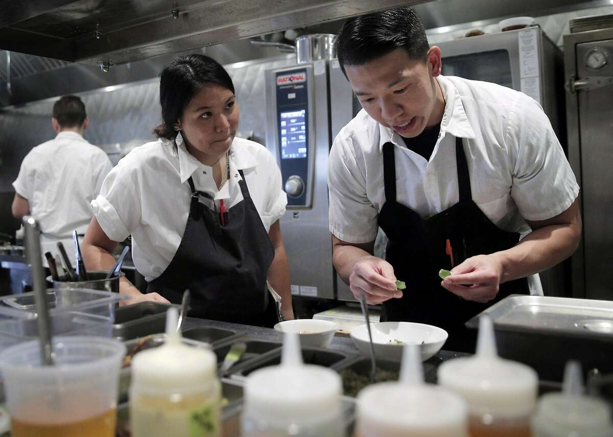 Brandon Chang, a line cook at Mister Jiu's, right, chats with TK as he helps to prep dinner service at the restaurant in San Francisco, Calif., on Tuesday, July 12, 2016.